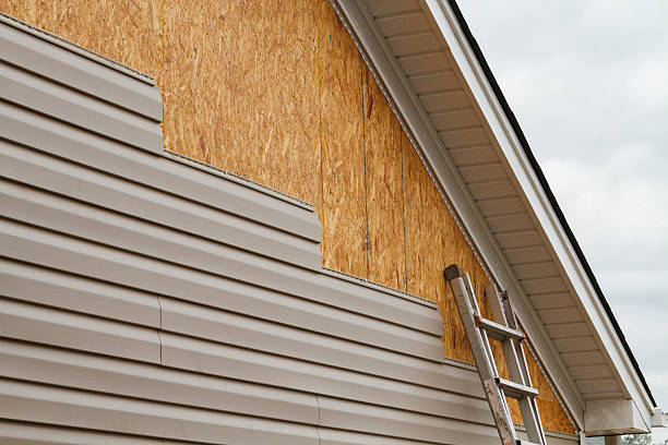 Professional Emergency Siding Repair technician working in Riverside, CT